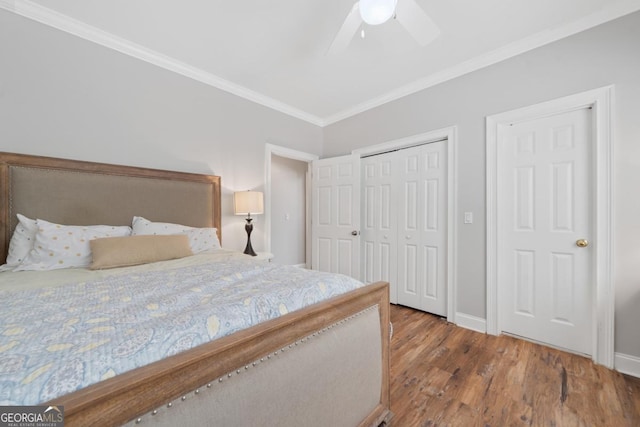 1081 Katherine Ln, Greensboro, GA 30642 - bedroom featuring a closet, baseboards, ornamental molding, a ceiling fan, and wood finished floors