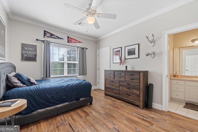 1081 Katherine Ln, Greensboro, GA 30642 - bedroom with light wood-type flooring, crown molding, baseboards, and ensuite bath