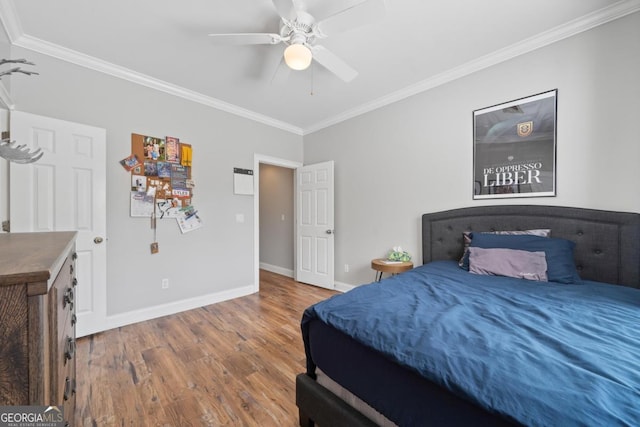 1081 Katherine Ln, Greensboro, GA 30642 - bedroom featuring baseboards, crown molding, a ceiling fan, and wood finished floors