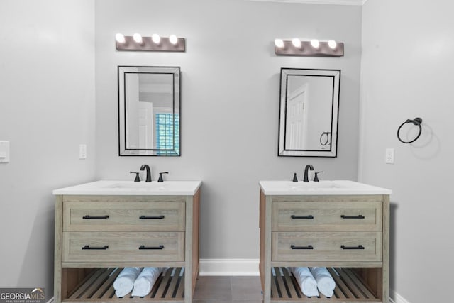1081 Katherine Ln, Greensboro, GA 30642 - full bathroom with a sink, two vanities, tile patterned flooring, and baseboards