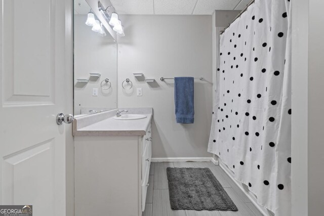 1081 Katherine Ln, Greensboro, GA 30642 - full bath with vanity, baseboards, and a shower with curtain