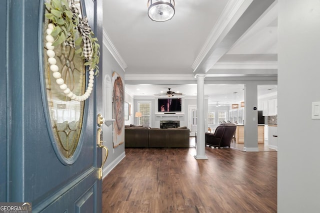1081 Katherine Ln, Greensboro, GA 30642 - entryway featuring a fireplace, dark wood finished floors, crown molding, ceiling fan, and decorative columns