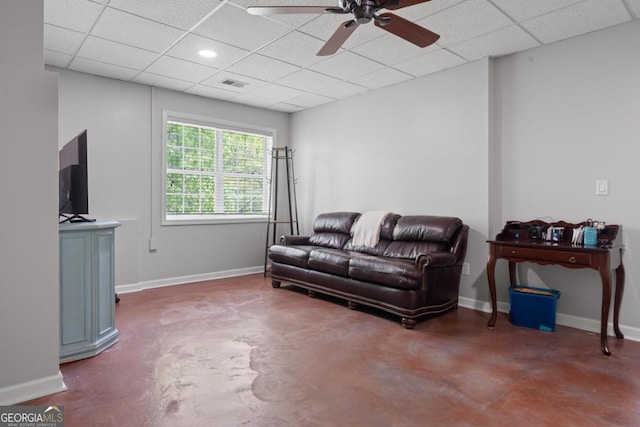 1081 Katherine Ln, Greensboro, GA 30642 - living area with finished concrete flooring, a drop ceiling, visible vents, and a ceiling fan