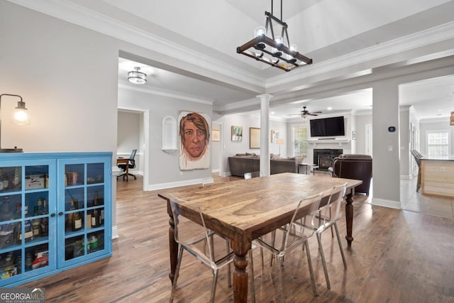 1081 Katherine Ln, Greensboro, GA 30642 - dining room with baseboards, ceiling fan, a fireplace, crown molding, and wood finished floors