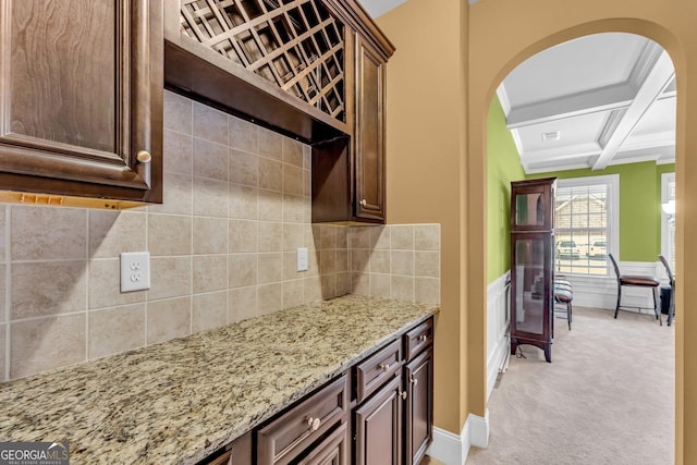 80 Lanier Rdg, Acworth, GA 30101 - kitchen featuring beamed ceiling, light stone counters, arched walkways, and coffered ceiling
