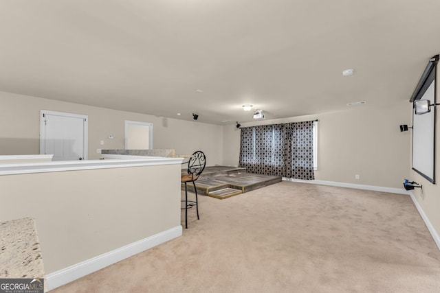 80 Lanier Rdg, Acworth, GA 30101 - unfurnished living room featuring baseboards and light colored carpet