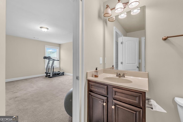 80 Lanier Rdg, Acworth, GA 30101 - bathroom featuring toilet, vanity, and baseboards