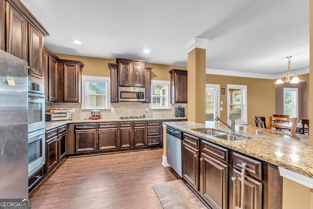 80 Lanier Rdg, Acworth, GA 30101 - kitchen with tasteful backsplash, wood finished floors, a sink, dark brown cabinetry, and appliances with stainless steel finishes