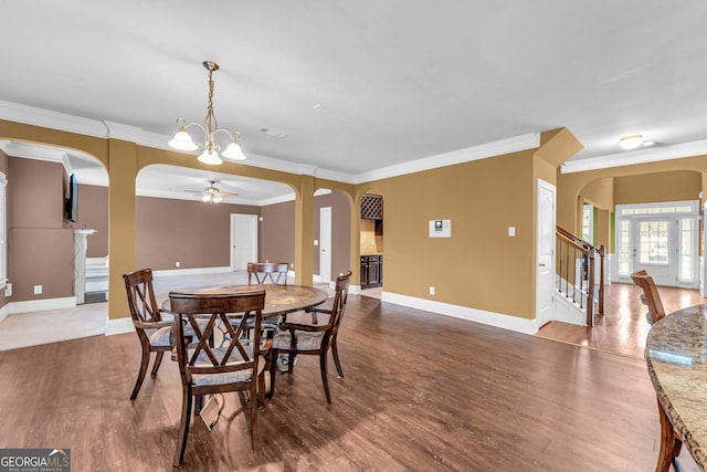 80 Lanier Rdg, Acworth, GA 30101 - dining area featuring wood finished floors, arched walkways, and ornamental molding