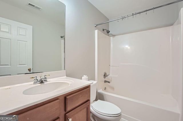 full bathroom featuring shower / washtub combination, toilet, vanity, and visible vents