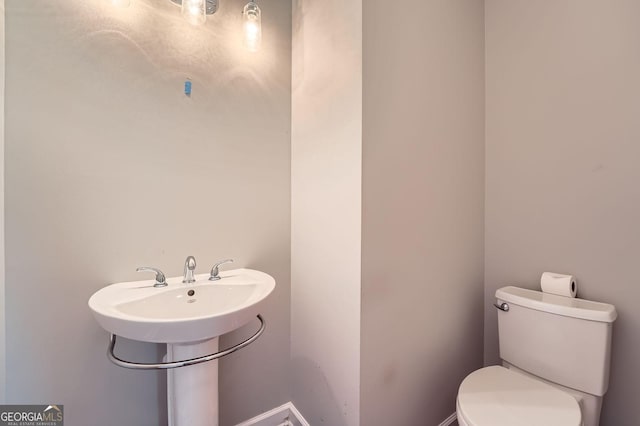 half bath featuring toilet