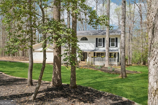 8012 Beachwood Dr, Murrayville, GA 30564 - view of front of home with a front lawn, an attached garage, covered porch, and stucco siding
