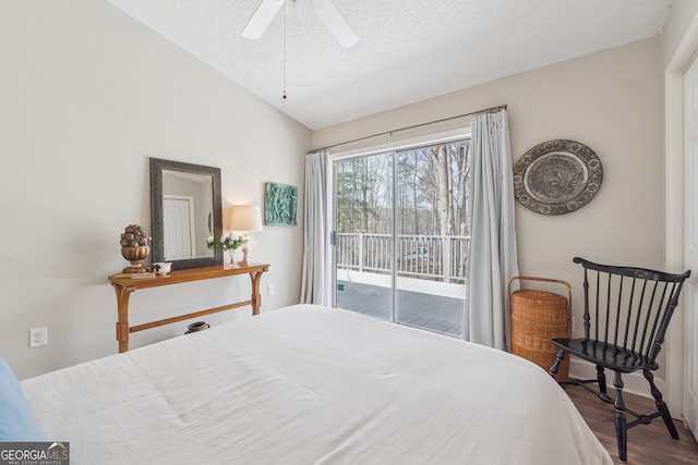 8012 Beachwood Dr, Murrayville, GA 30564 - bedroom featuring vaulted ceiling, a textured ceiling, a ceiling fan, access to exterior, and wood finished floors