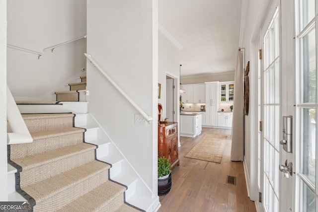 8012 Beachwood Dr, Murrayville, GA 30564 - entryway with stairway, french doors, crown molding, visible vents, and light wood finished floors