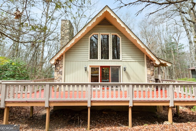374 W Sugarbush Dr, Sky Valley, GA 30537 - back of property featuring stone siding, a chimney, and a wooden deck