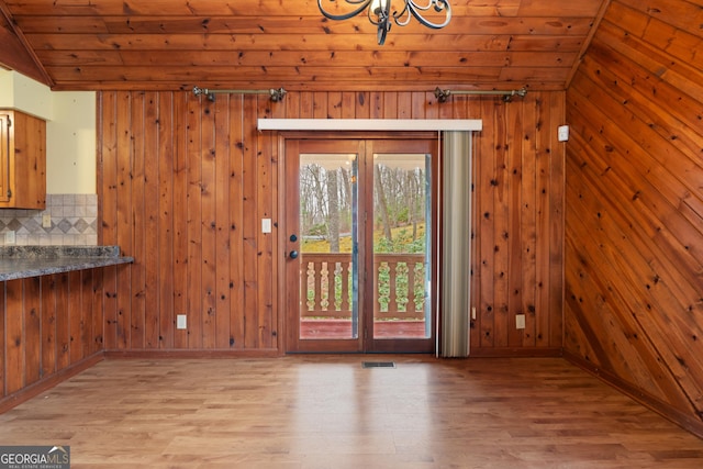 374 W Sugarbush Dr, Sky Valley, GA 30537 - unfurnished dining area with visible vents, wooden ceiling, an inviting chandelier, and wood finished floors