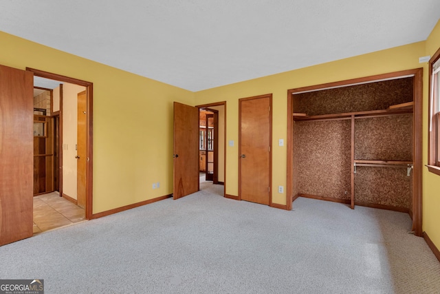 374 W Sugarbush Dr, Sky Valley, GA 30537 - unfurnished bedroom featuring two closets, ensuite bathroom, baseboards, and carpet