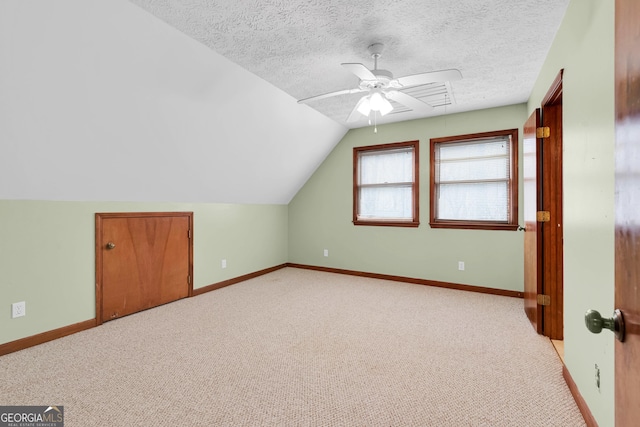 374 W Sugarbush Dr, Sky Valley, GA 30537 - bonus room with light carpet, a textured ceiling, baseboards, and lofted ceiling
