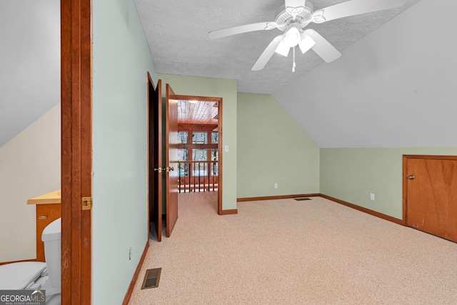 374 W Sugarbush Dr, Sky Valley, GA 30537 - additional living space featuring baseboards, vaulted ceiling, a textured ceiling, visible vents, and ceiling fan