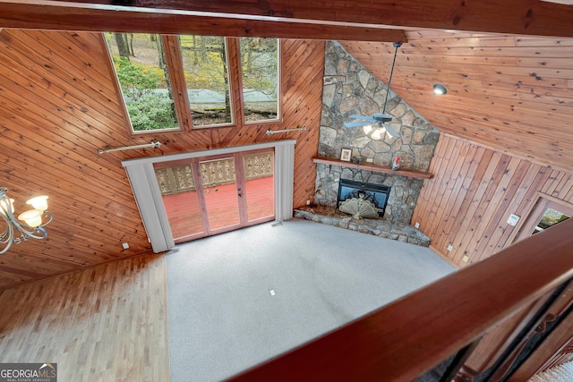 374 W Sugarbush Dr, Sky Valley, GA 30537 - unfurnished living room with wood walls, a stone fireplace, high vaulted ceiling, and wood ceiling