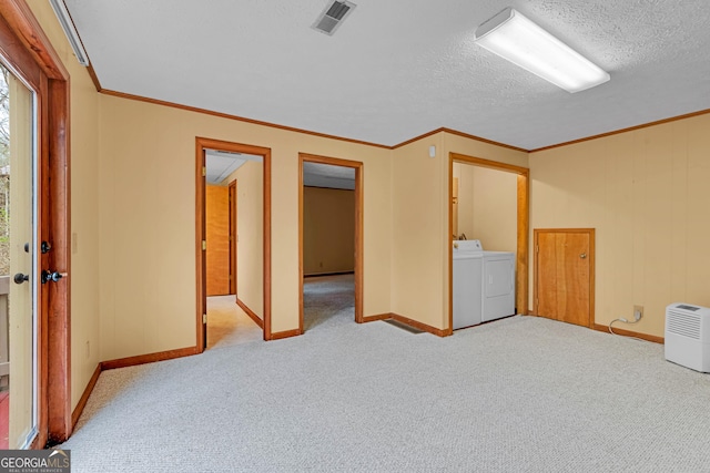 374 W Sugarbush Dr, Sky Valley, GA 30537 - carpeted empty room with ornamental molding, visible vents, washing machine and clothes dryer, and a textured ceiling