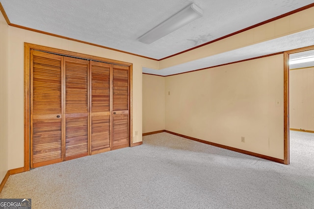 374 W Sugarbush Dr, Sky Valley, GA 30537 - unfurnished bedroom with a textured ceiling, a closet, carpet flooring, and ornamental molding