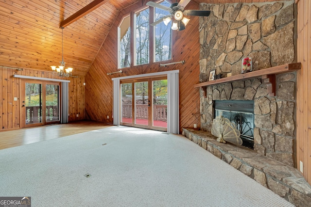 374 W Sugarbush Dr, Sky Valley, GA 30537 - unfurnished living room with ceiling fan with notable chandelier, carpet, a stone fireplace, wooden ceiling, and wood walls