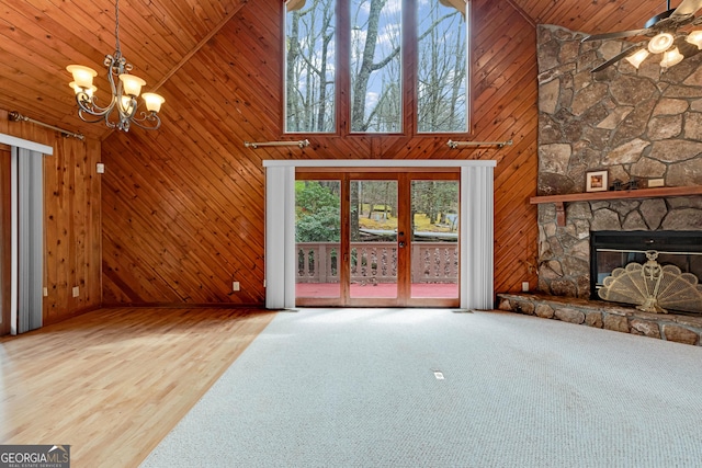 374 W Sugarbush Dr, Sky Valley, GA 30537 - unfurnished living room featuring high vaulted ceiling, wooden walls, ceiling fan with notable chandelier, and wooden ceiling