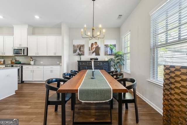 6023 Skellig St, Norcross, GA 30071 - dining space featuring a chandelier, dark wood-type flooring, and recessed lighting