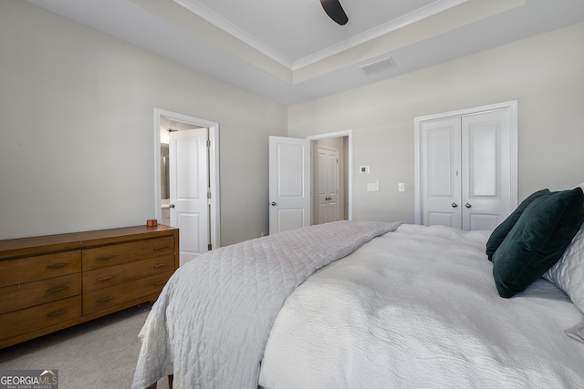 6023 Skellig St, Norcross, GA 30071 - bedroom with a closet, carpet, a tray ceiling, ornamental molding, and a ceiling fan