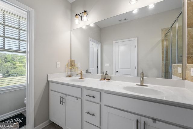 6023 Skellig St, Norcross, GA 30071 - bathroom featuring double vanity and a shower stall