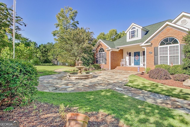 494 Thrash Rd, Lagrange, GA 30241 - view of front of house with brick siding, a front yard, and a shingled roof