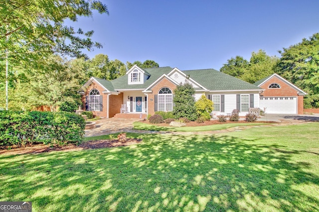 494 Thrash Rd, Lagrange, GA 30241 - traditional-style house featuring a garage, a front yard, an outdoor structure, and brick siding