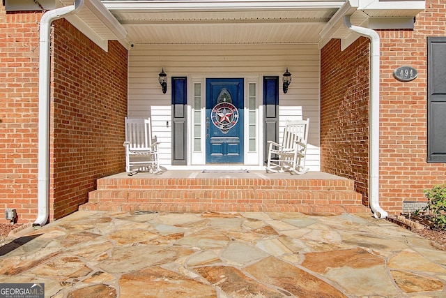 494 Thrash Rd, Lagrange, GA 30241 - doorway to property featuring brick siding and covered porch