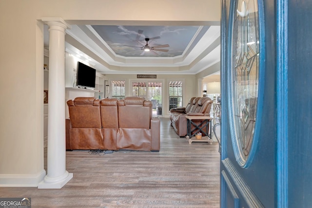 494 Thrash Rd, Lagrange, GA 30241 - entryway featuring ornate columns, ceiling fan, a raised ceiling, wood finished floors, and ornamental molding