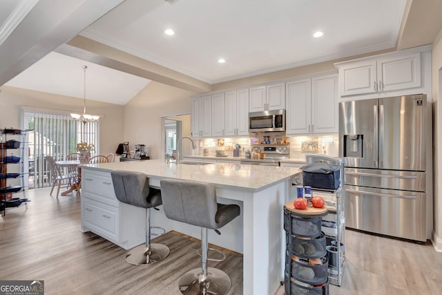 494 Thrash Rd, Lagrange, GA 30241 - kitchen with appliances with stainless steel finishes, a sink, light wood-style flooring, backsplash, and white cabinets