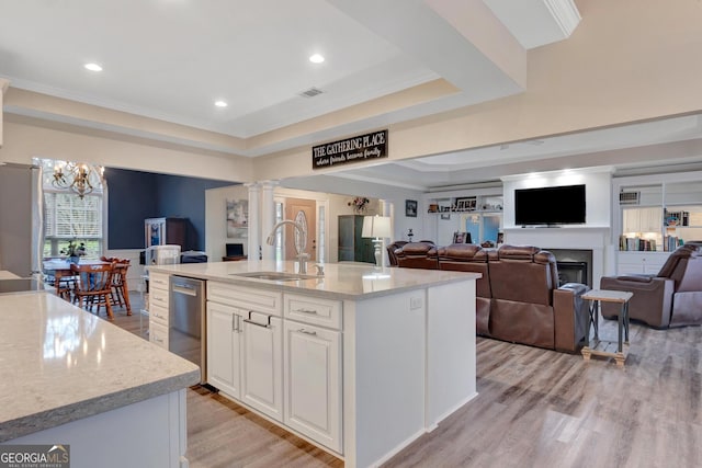 494 Thrash Rd, Lagrange, GA 30241 - kitchen with a sink, appliances with stainless steel finishes, ornate columns, a raised ceiling, and light wood-style flooring