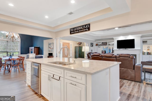 494 Thrash Rd, Lagrange, GA 30241 - kitchen featuring a sink, dishwasher, a raised ceiling, a kitchen island with sink, and decorative columns