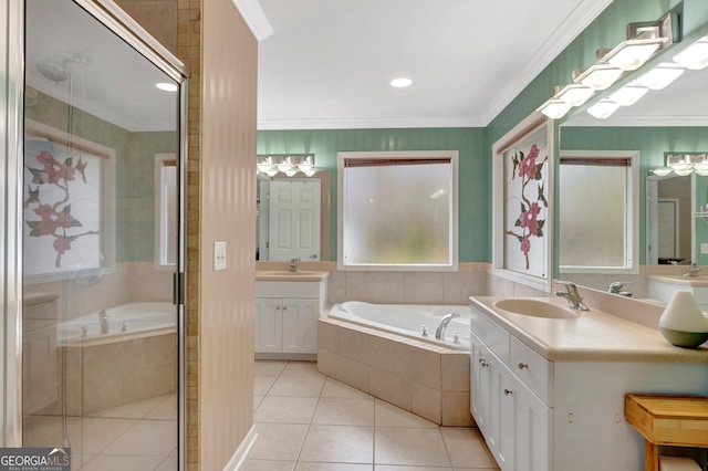 494 Thrash Rd, Lagrange, GA 30241 - bathroom with tile patterned floors, a bath, two vanities, a stall shower, and ornamental molding