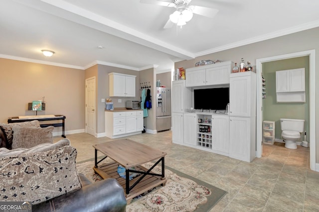 494 Thrash Rd, Lagrange, GA 30241 - living area with ceiling fan, stone finish floors, crown molding, and baseboards