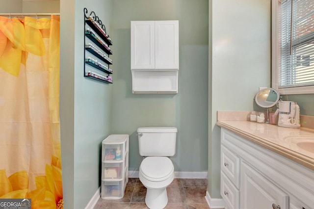 494 Thrash Rd, Lagrange, GA 30241 - bathroom featuring vanity, toilet, baseboards, a shower with shower curtain, and tile patterned floors