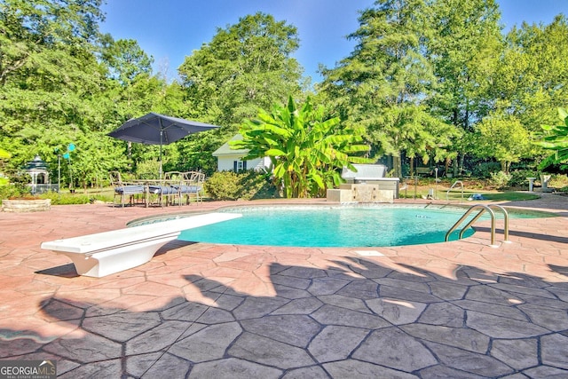 494 Thrash Rd, Lagrange, GA 30241 - swimming pool with a patio, a diving board, and view of scattered trees