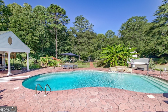 494 Thrash Rd, Lagrange, GA 30241 - swimming pool featuring a patio and view of wooded area