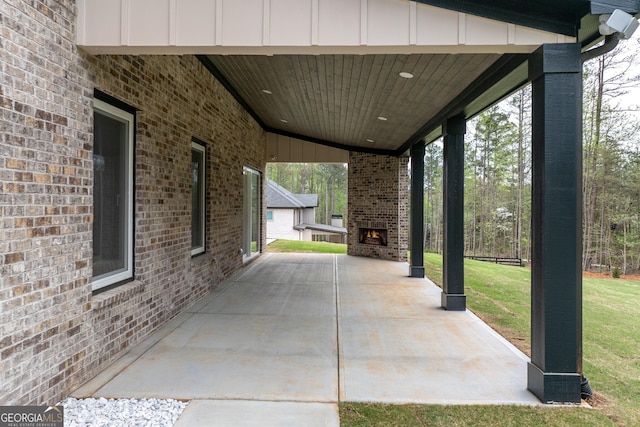 2107 E Maddox Rd, Buford, GA 30519 - view of patio / terrace with an outdoor brick fireplace