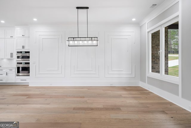 2107 E Maddox Rd, Buford, GA 30519 - unfurnished dining area featuring light wood-type flooring, recessed lighting, and a healthy amount of sunlight
