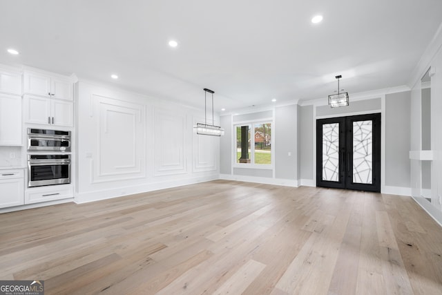 2107 E Maddox Rd, Buford, GA 30519 - foyer with crown molding, light wood-style flooring, recessed lighting, and french doors