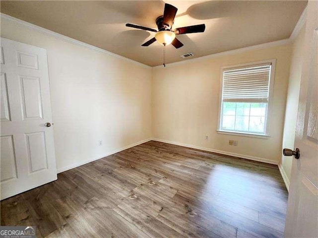 645 Crossbridge Aly, Johns Creek, GA 30022 - empty room featuring crown molding, a ceiling fan, visible vents, wood finished floors, and baseboards
