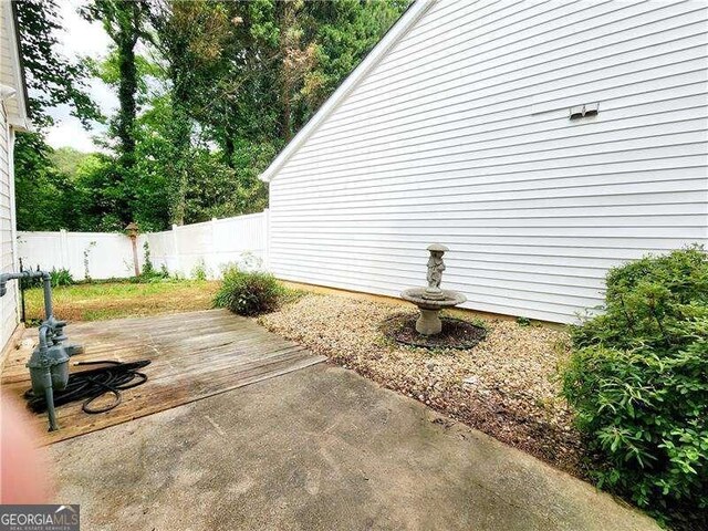 645 Crossbridge Aly, Johns Creek, GA 30022 - view of patio / terrace with fence