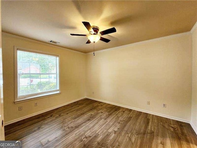645 Crossbridge Aly, Johns Creek, GA 30022 - empty room featuring visible vents, baseboards, ornamental molding, ceiling fan, and wood finished floors
