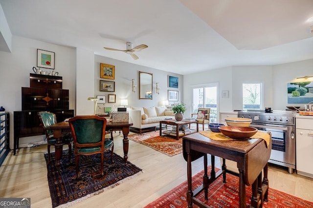 587 Virginia Ave NE Unit 314, Atlanta, GA 30306 - living area with a ceiling fan and light wood finished floors